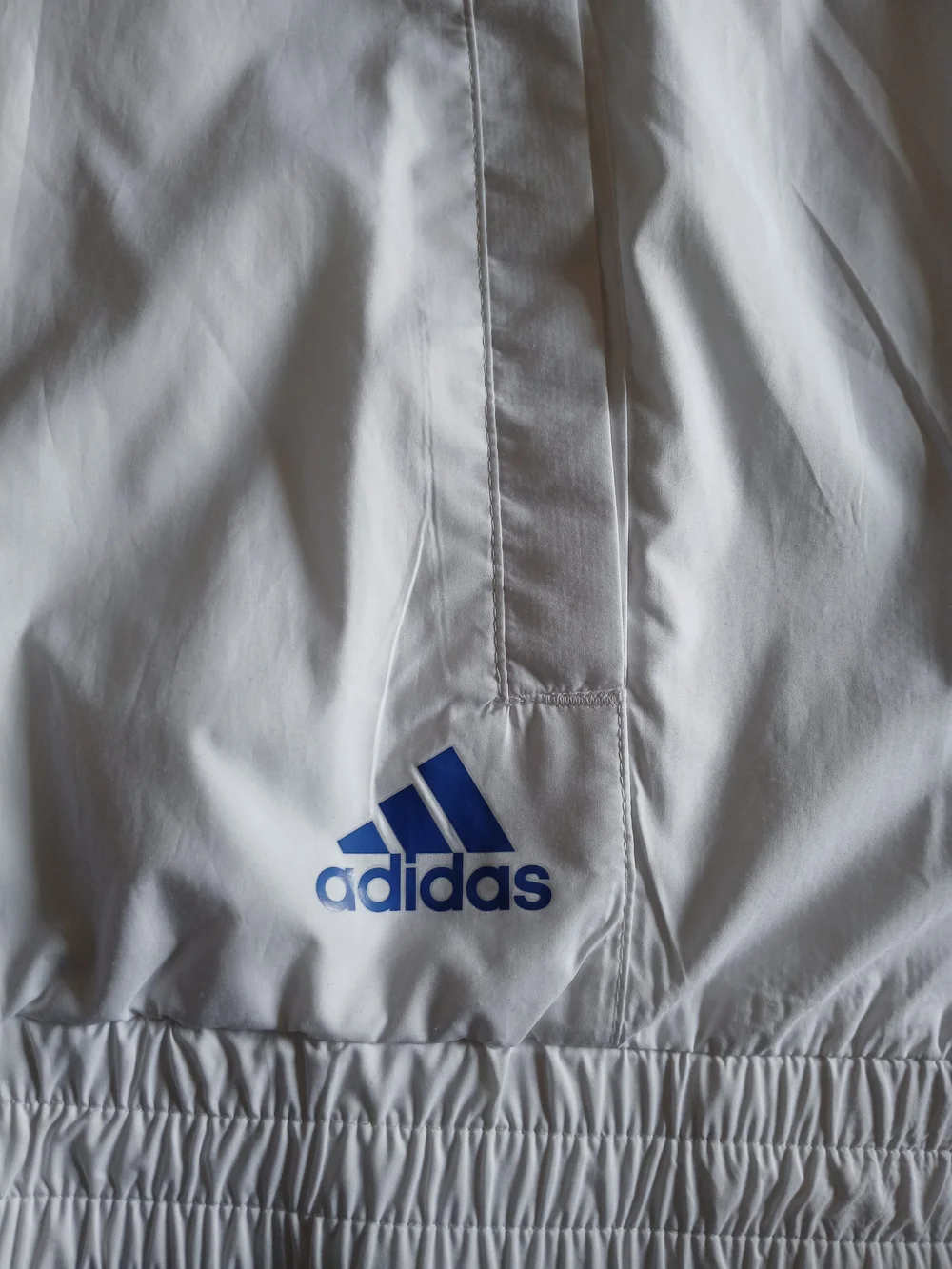 adidas Mens White Windbreaker with Blue Chevron Stripes and Logo